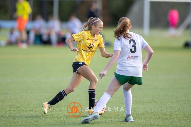 Sting 13G Academy player taking on a Harbor Premier defender