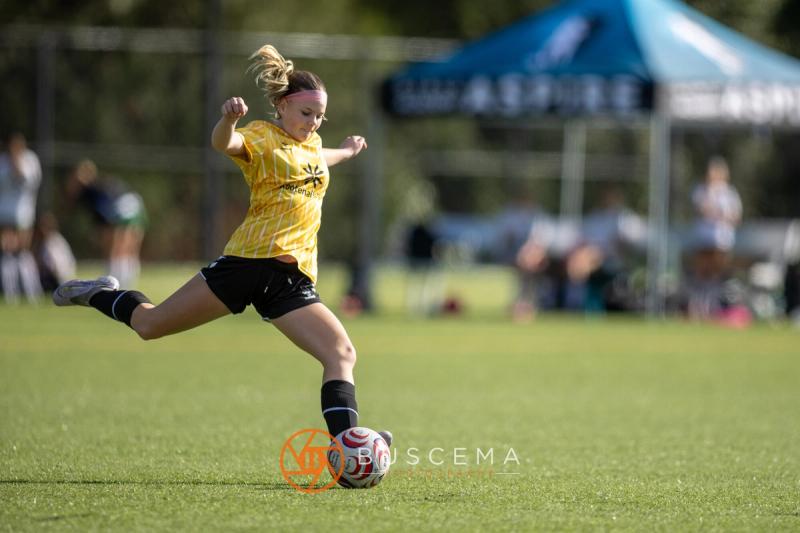 Sting 13G Academy player taking a big swing at the ball