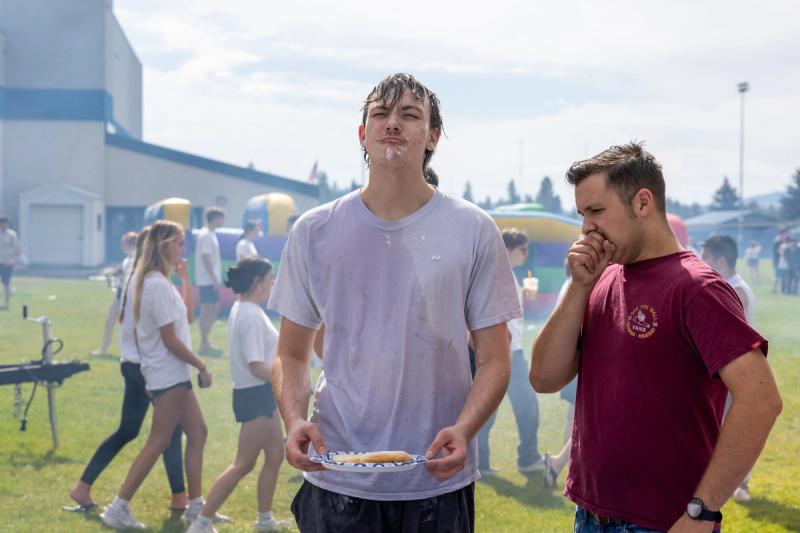 Coeur d'Alene senior holding a plate of food at the senior kickoff barbecue