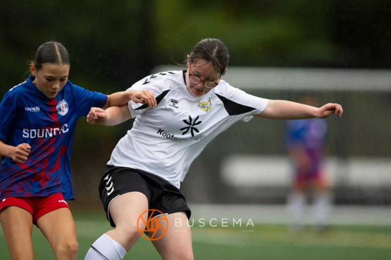 Sting 13-14G Academy player striking the ball under pressure