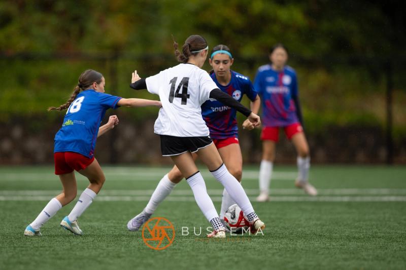 Sting 13-14G Academy number 14 in a midfield battle with Sound FC