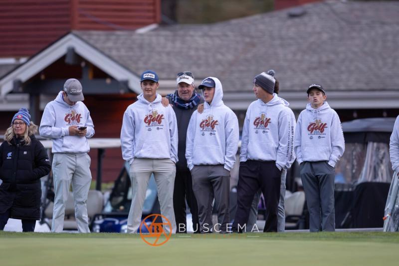 Boys team watching from beside the clubhouse at the 6A state golf championships at Avondale Golf Club