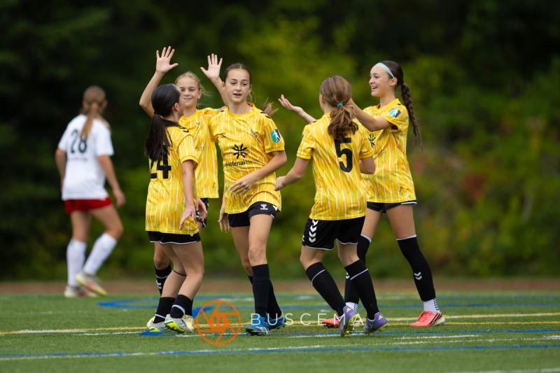 Sting 13-14G Academy players celebrating together after a goal
