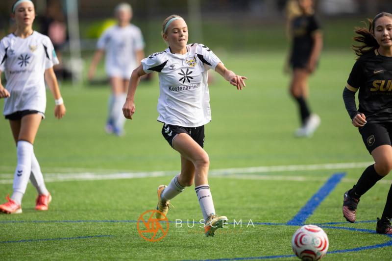 Sting 13G Academy player bringing the ball upfield