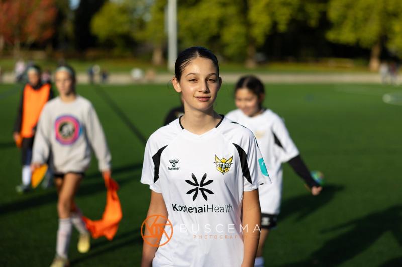 Smiling Sting 13G Academy player posing on the field