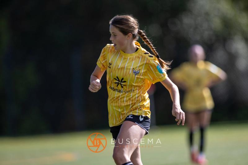 Sting 13G Academy player running down the field