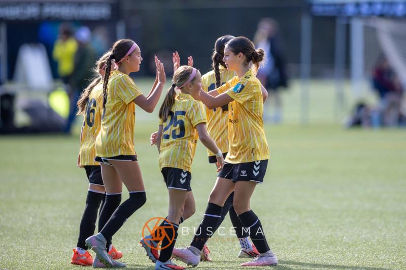 Sting 13G Academy players celebrating with high fives