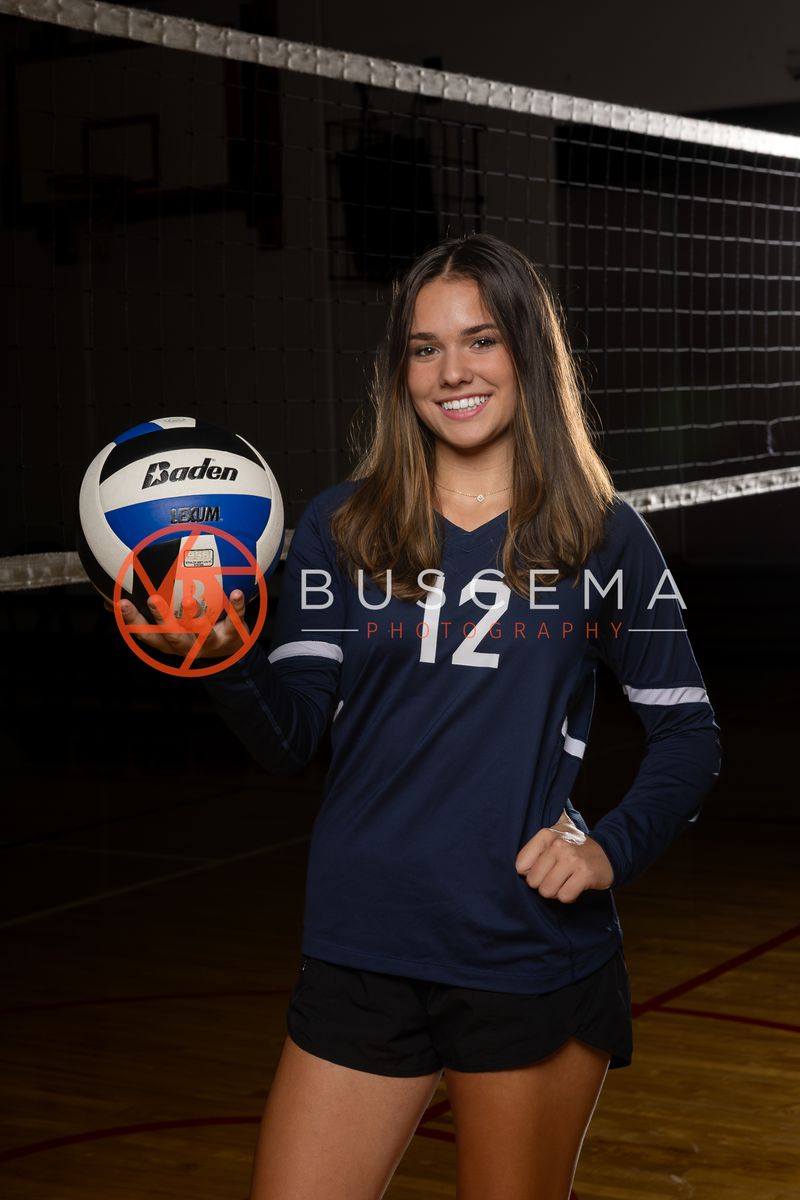 Coeur du Christ Academy Saints volleyball player in a number 12 jersey