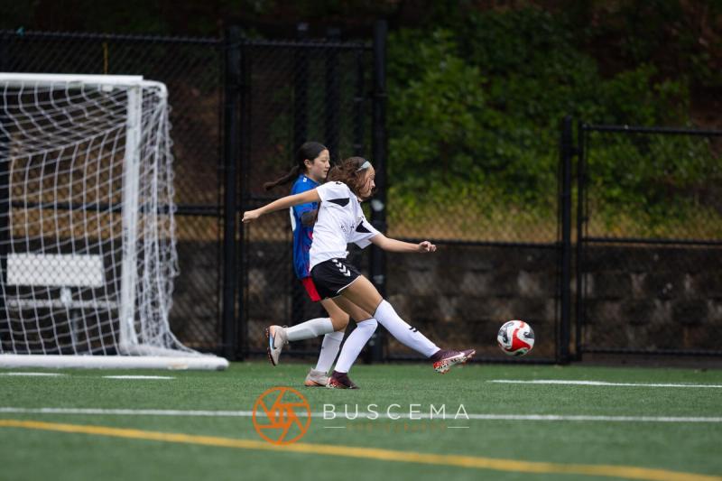 Sting 13-14G Academy player shooting toward the Sound FC goal