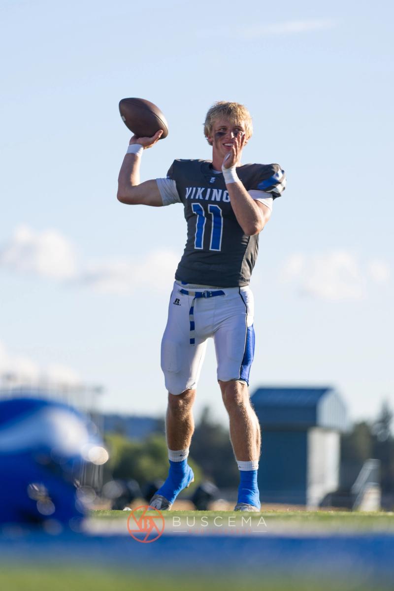 Coeur d'Alene Vikings quarterback number 11 winding up to throw before the 2026 home opener