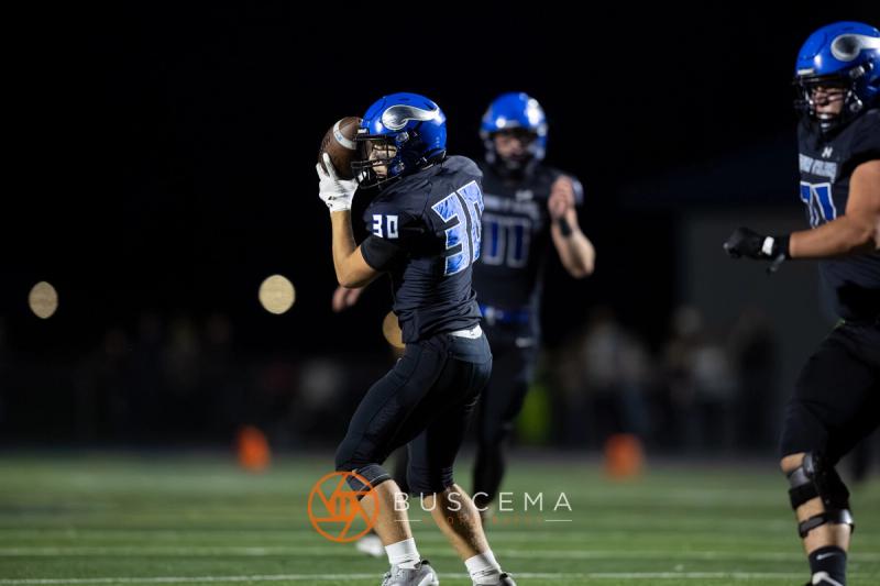 Coeur d'Alene quarterback releasing a pass against Rigby