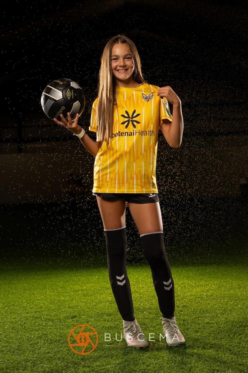Sting 13G Academy player holding a ball out to the side