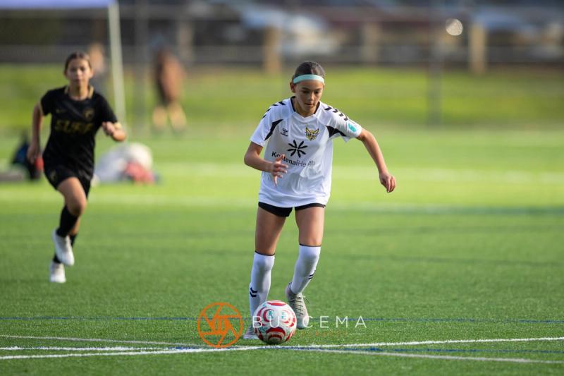 Sting 13G Academy player controlling the ball in the sun