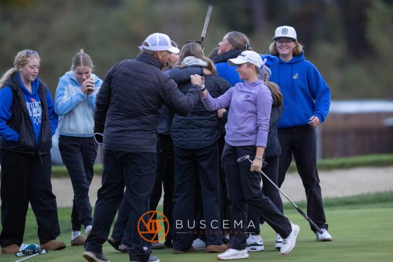 Coeur d'Alene girls team hugging in a group after finishing at the 6A state golf championships at Avondale Golf Club