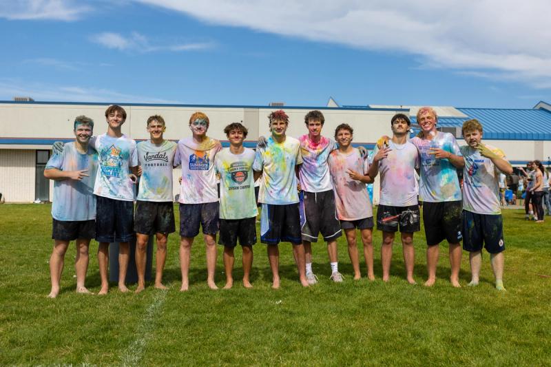 Coeur d'Alene seniors lined up in color covered shirts after the throw