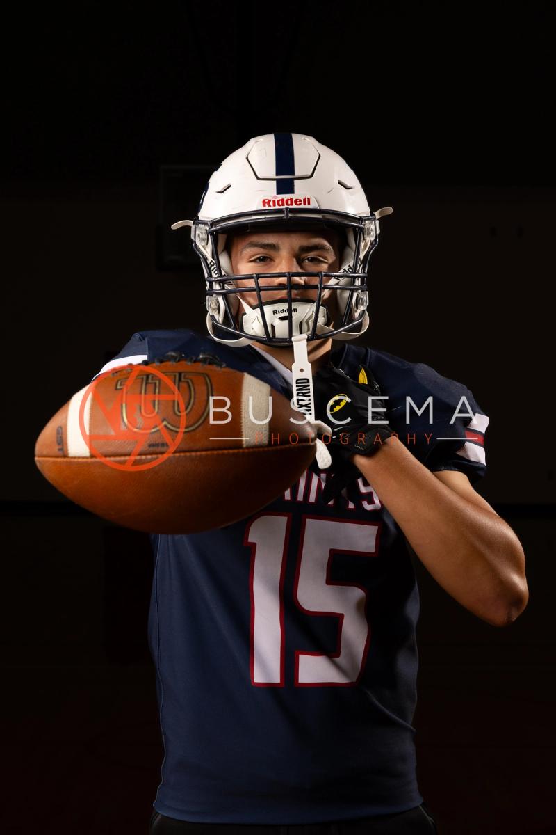 Coeur du Christ Academy football player in a helmet holding a football, 2026 season