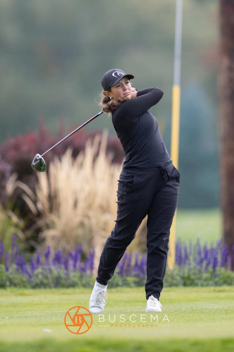 Girls golfer finishing her tee shot at the 6A state golf championships at Avondale Golf Club