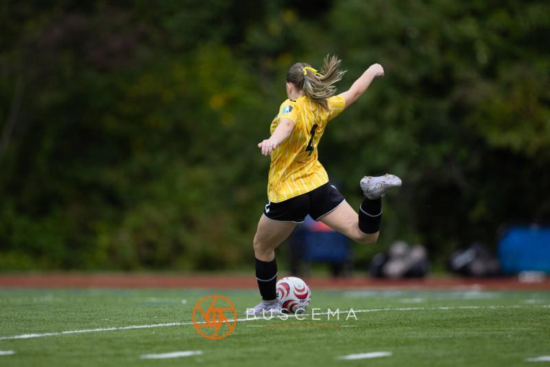 Sting 13-14G Academy player striking the ball upfield
