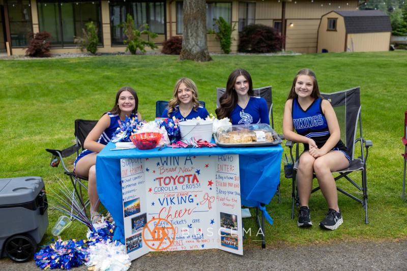 CHS cheerleaders at their Viking Cheer fundraising table on the course