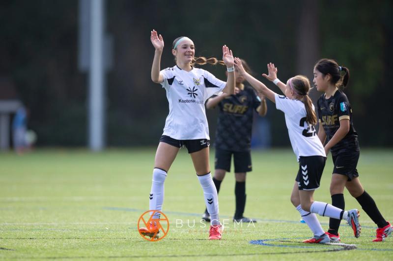 Sting 13G Academy players celebrating with their arms up