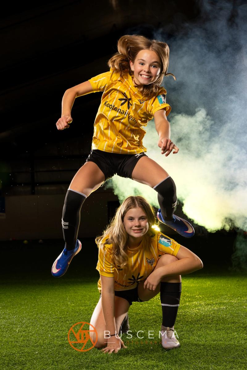 Sting 13G Academy player leaping over a teammate