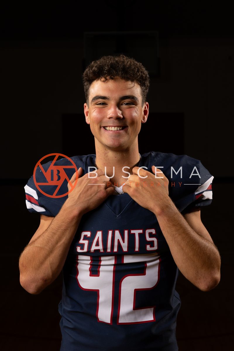 Coeur du Christ Academy football player in a number 42 Saints jersey