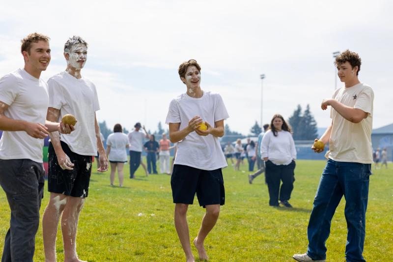 Coeur d'Alene seniors on the practice field during the shaving cream fight