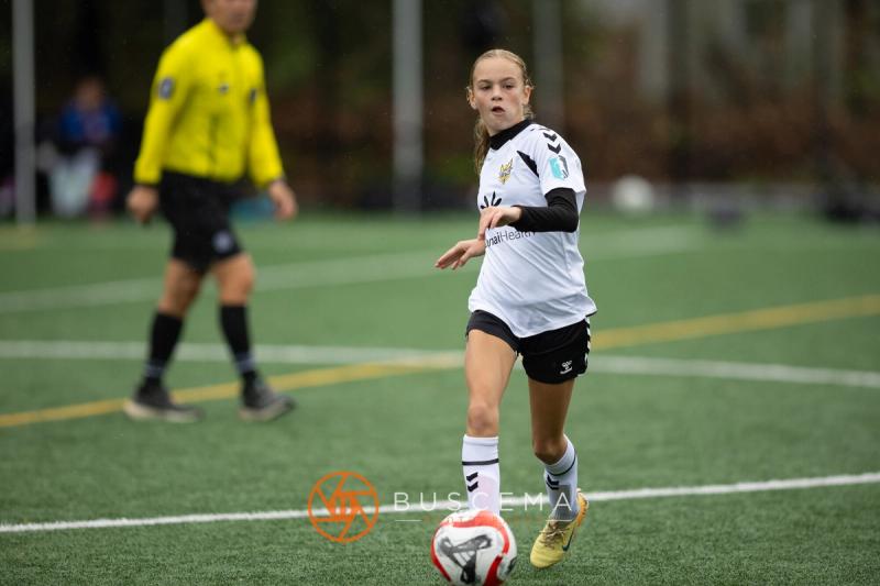 Sting 13-14G Academy player keeping possession against Sound FC