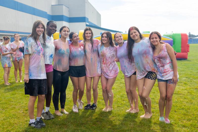 Coeur d'Alene senior girls posed together in color covered shirts