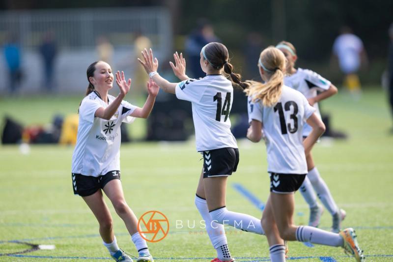 Sting 13G Academy players high fiving after a goal