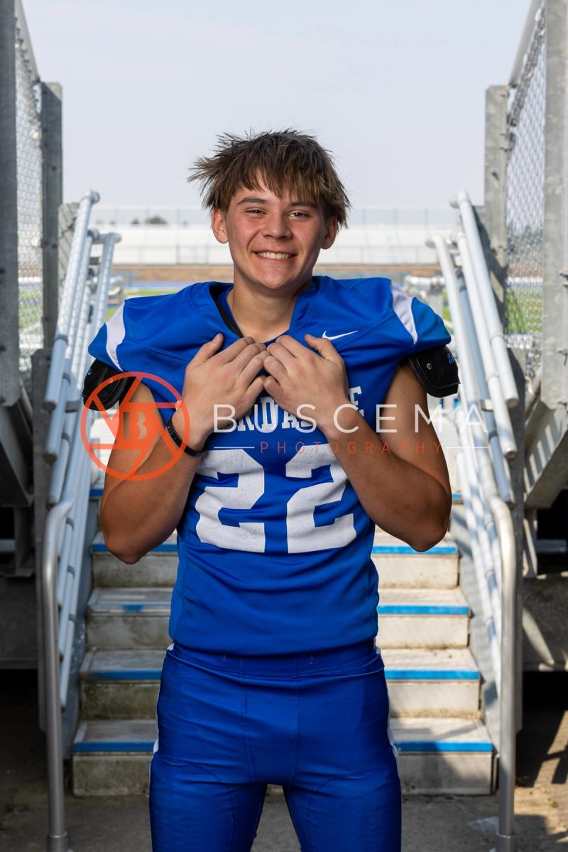 Coeur d'Alene Vikings football player portrait on the stadium bleacher steps, 2026 season