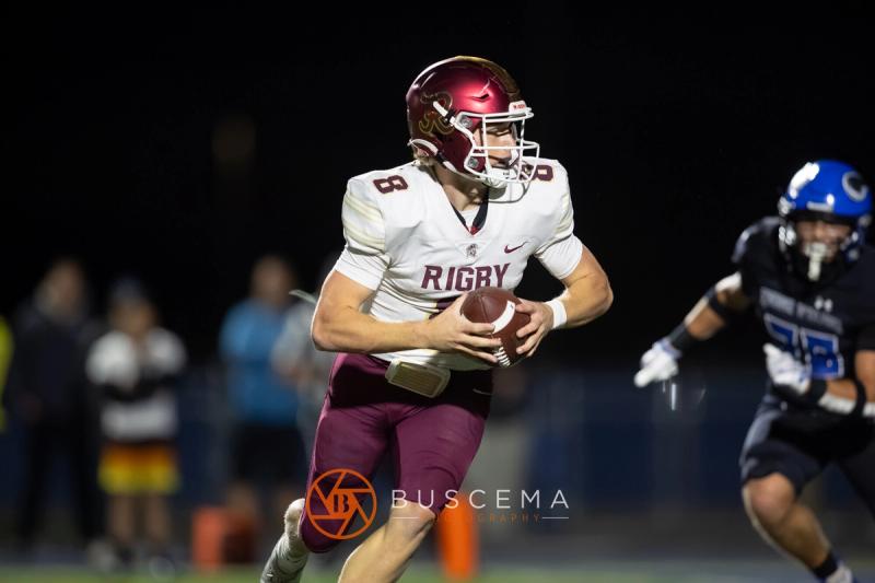 Rigby's quarterback keeping the ball and running against Coeur d'Alene