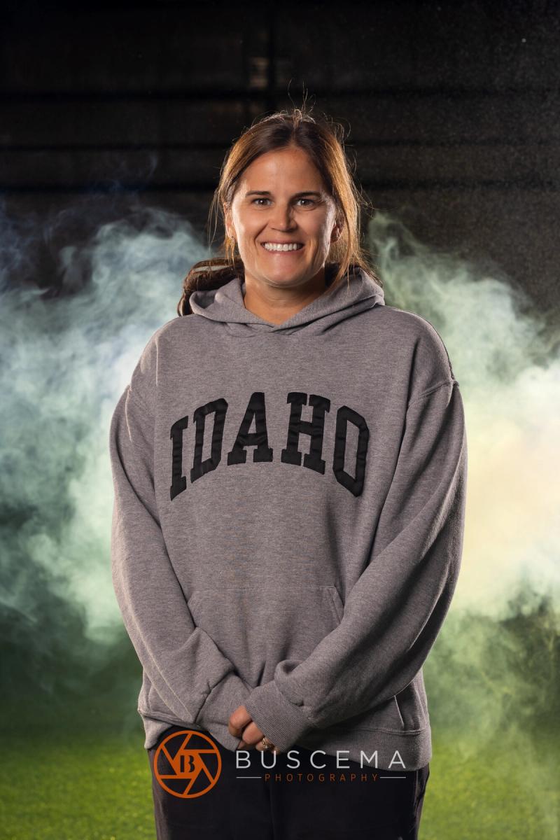 Sting 13G Academy coach smiling in an Idaho sweatshirt
