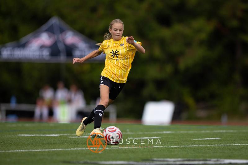 Sting 13-14G Academy player striking the ball toward goal