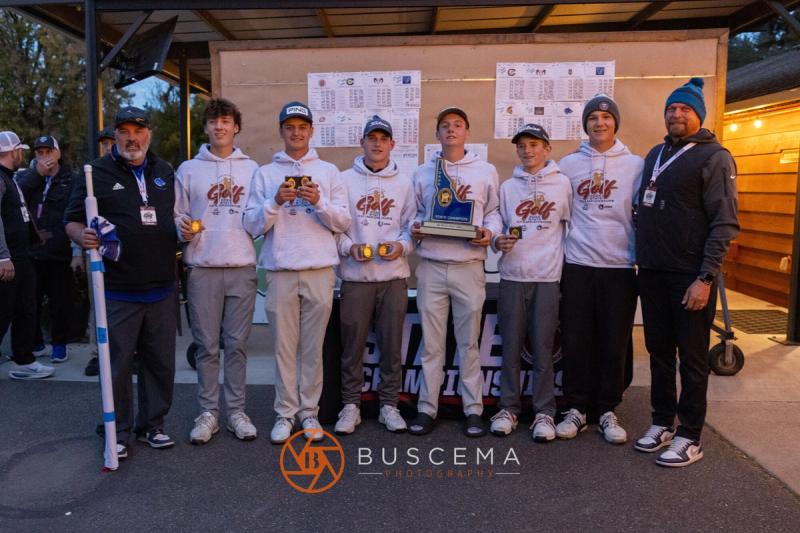 Boys team posing with their state trophy and medals at the 6A state golf championships at Avondale Golf Club