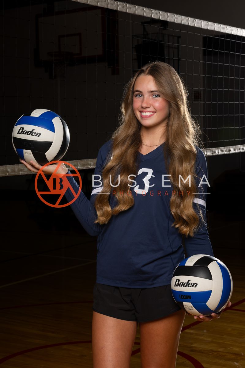 Coeur du Christ Academy Saints volleyball player with a volleyball in the gym