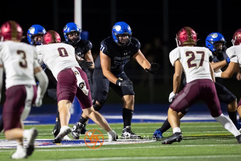Coeur d'Alene and Rigby linemen meeting at the snap