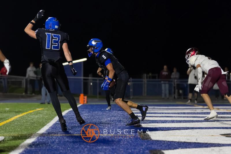 A Coeur d'Alene player celebrates in the end zone against Rigby