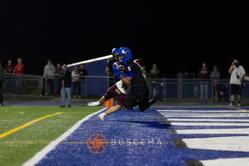 A Coeur d'Alene player in the end zone with the ball against Rigby