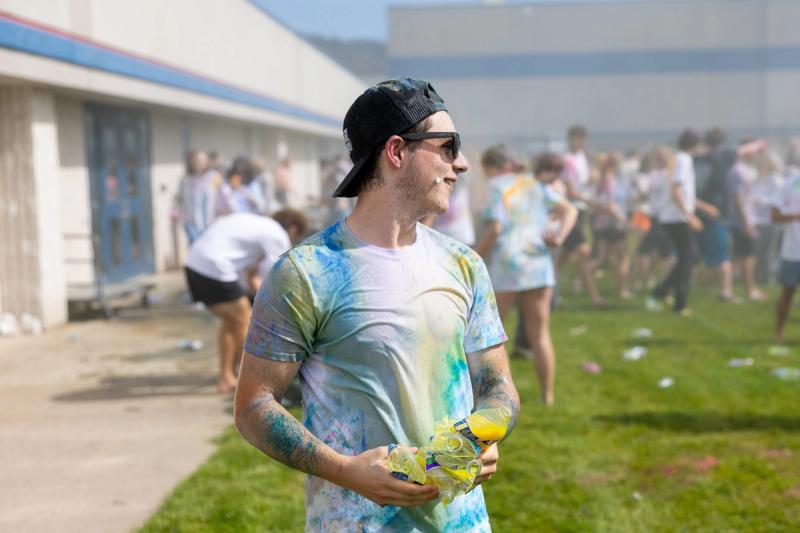 Coeur d'Alene senior walking through the haze after the color throw