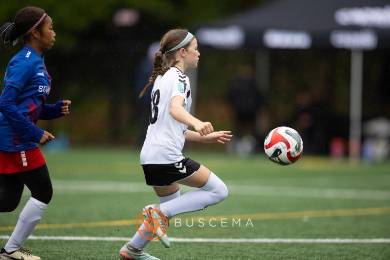 Sting 13-14G Academy player receiving the ball under pressure