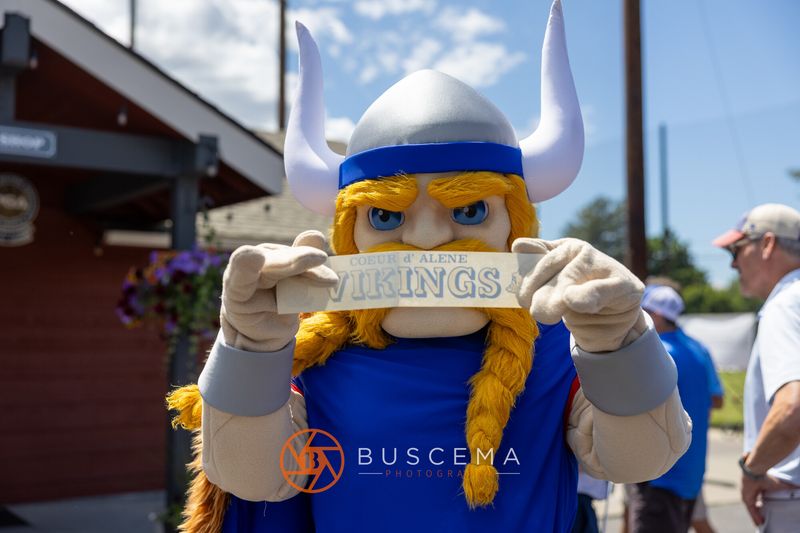 The Viking mascot holding up a Coeur d'Alene Vikings sign