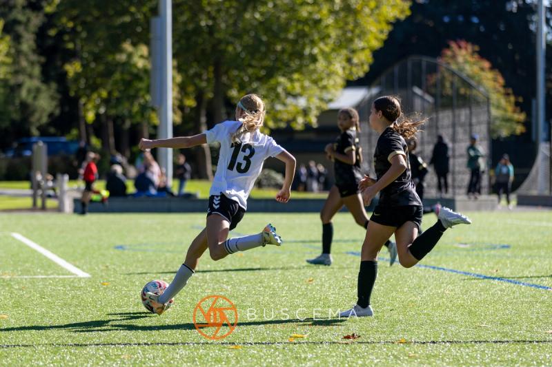 Sting 13G Academy player number 13 taking the ball upfield