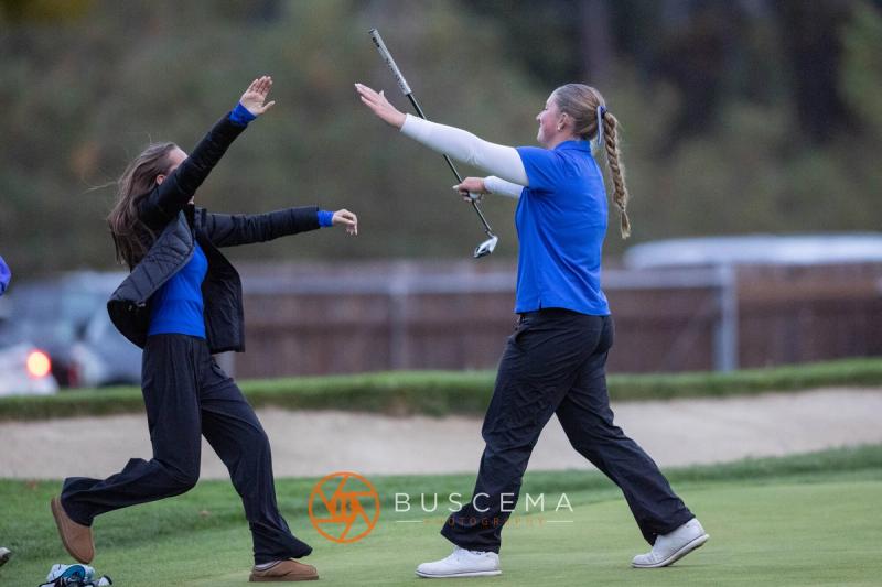 Coeur d'Alene girls golfers running to celebrate on the final green at the 6A state golf championships at Avondale Golf Club
