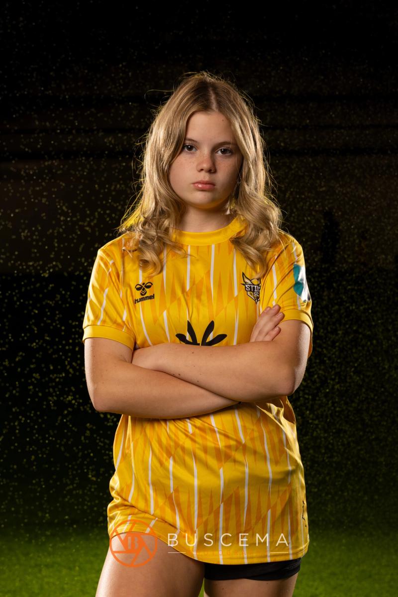Sting 13G Academy player with her arms crossed