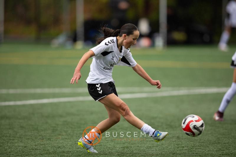 Sting 13-14G Academy player crossing the ball against Sound FC