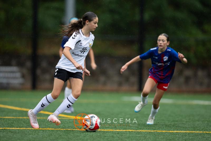 Sting 13-14G Academy player dribbling past a Sound FC defender
