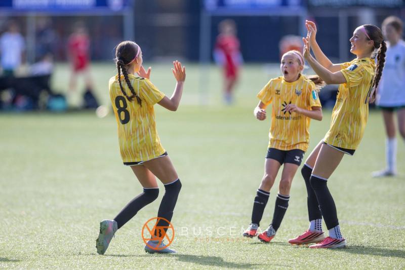 Sting 13G Academy players high fiving after a goal