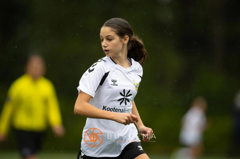 Sting 13-14G Academy player moving into space against Sound FC