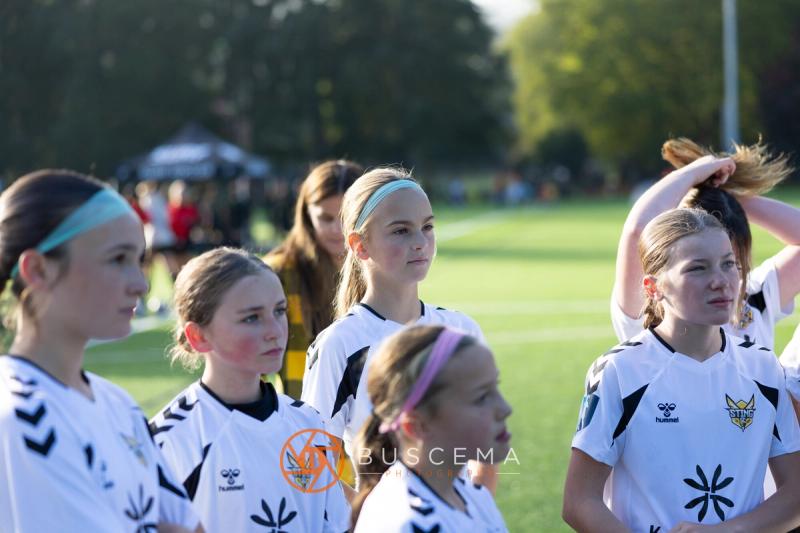Sting 13G Academy players listening on the sideline before the game